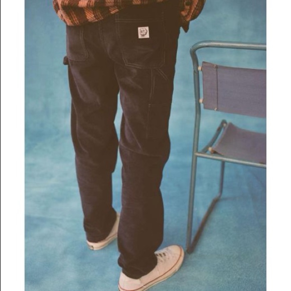 BDG painter pants black corduroy unisex size L has a small inseam repair needed